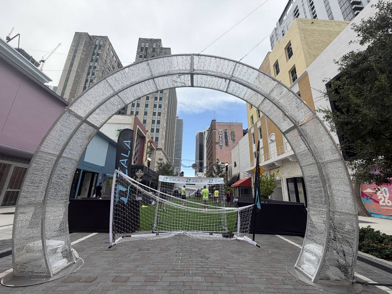 The arch and goal on the pop-up pitch, downtown Miami skyline behind